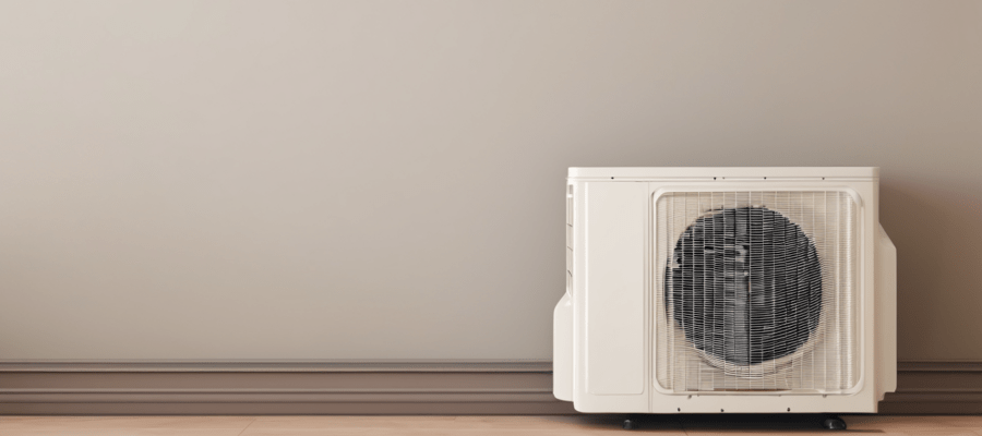 What to Expect From an AC Repair Appointment - technician inspecting split AC indoor unit in Dubai apartment