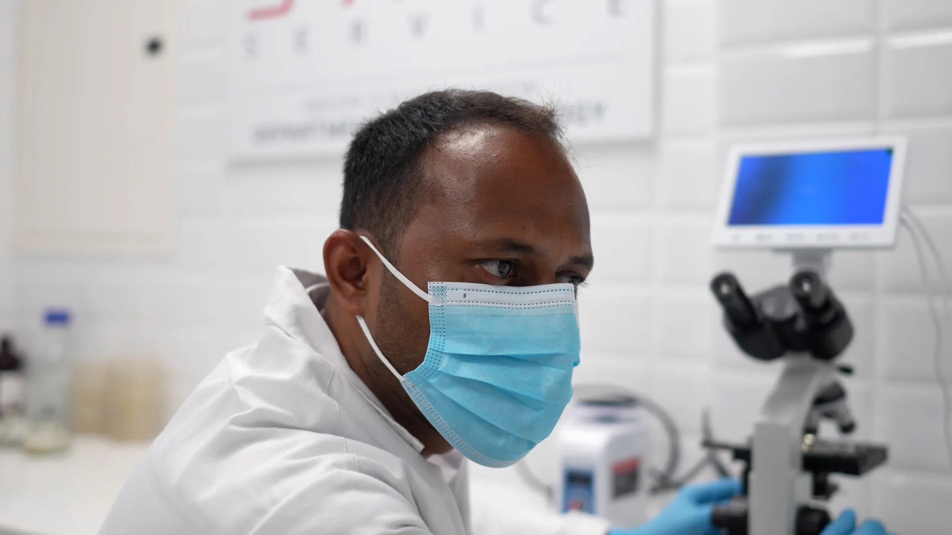 A Saniservice microbiologist at the microscope in the in-house Department of Microbiology