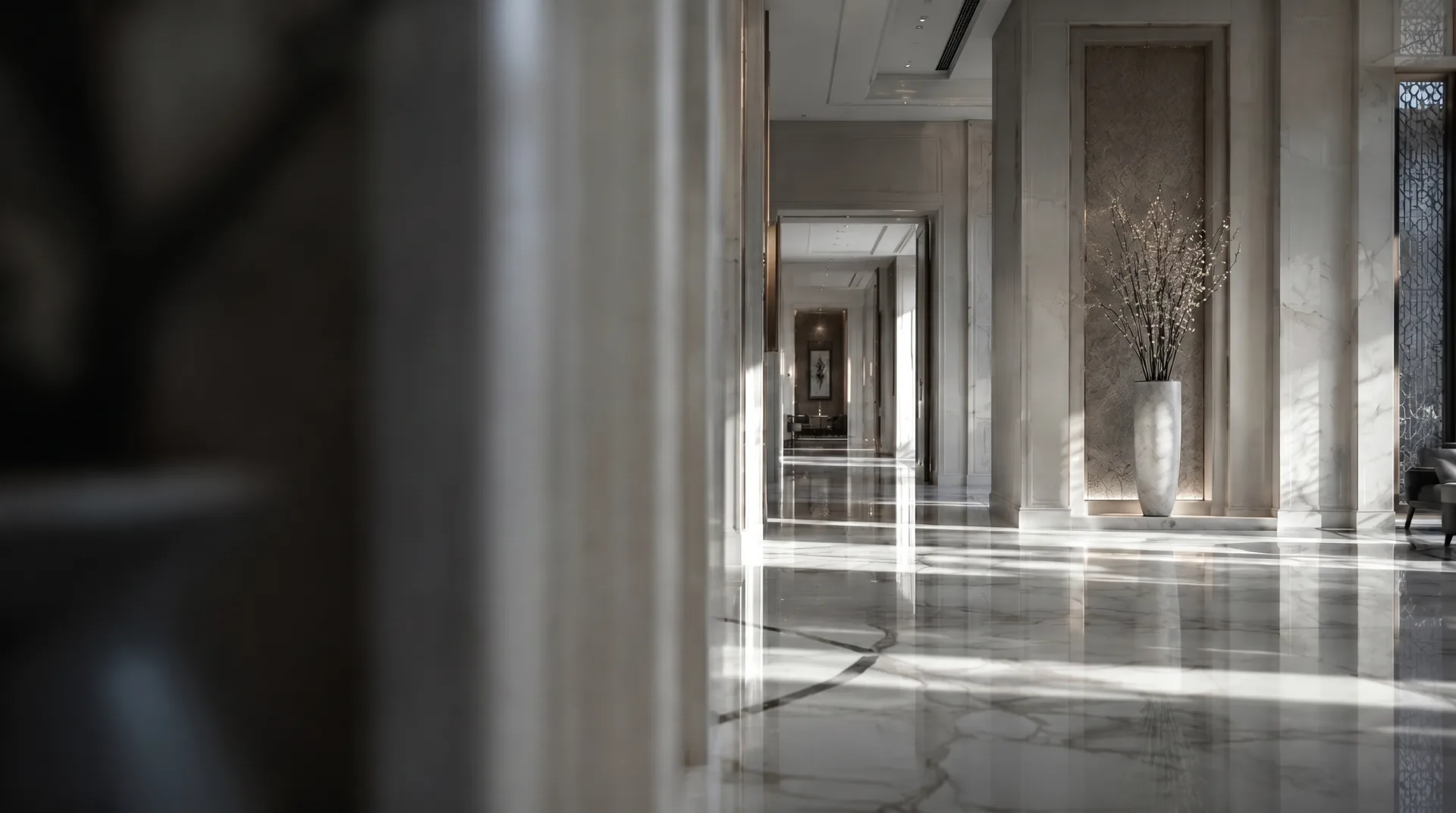 A luxury hotel lobby with polished marble floors and soft daylight